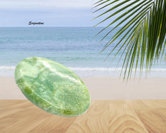 GEMSCITE Serpentine worry stone thumb depression used for mindful rubbing.