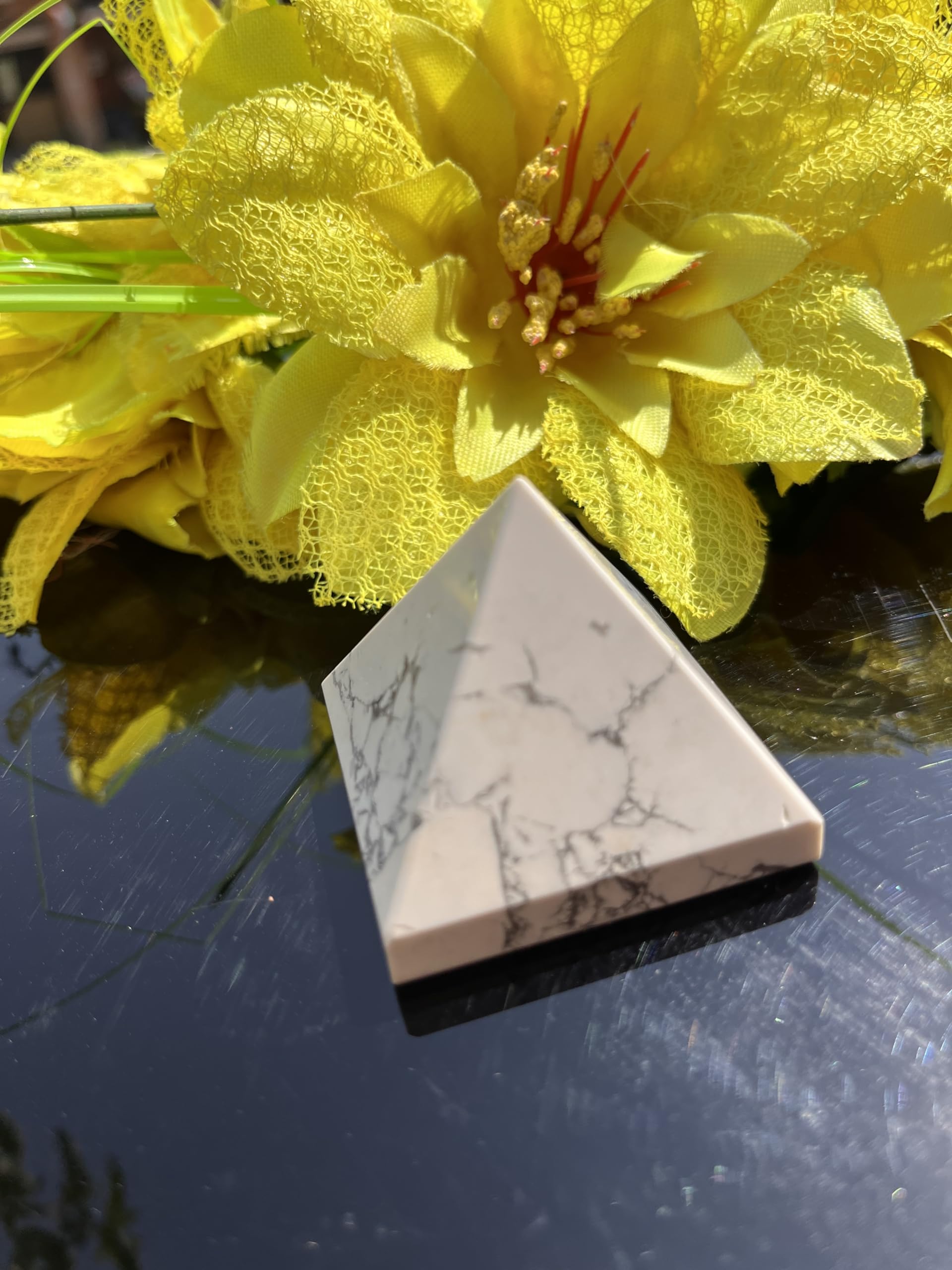Generic 50-55mm Howlite pyramid fits bedside display for calm nights.