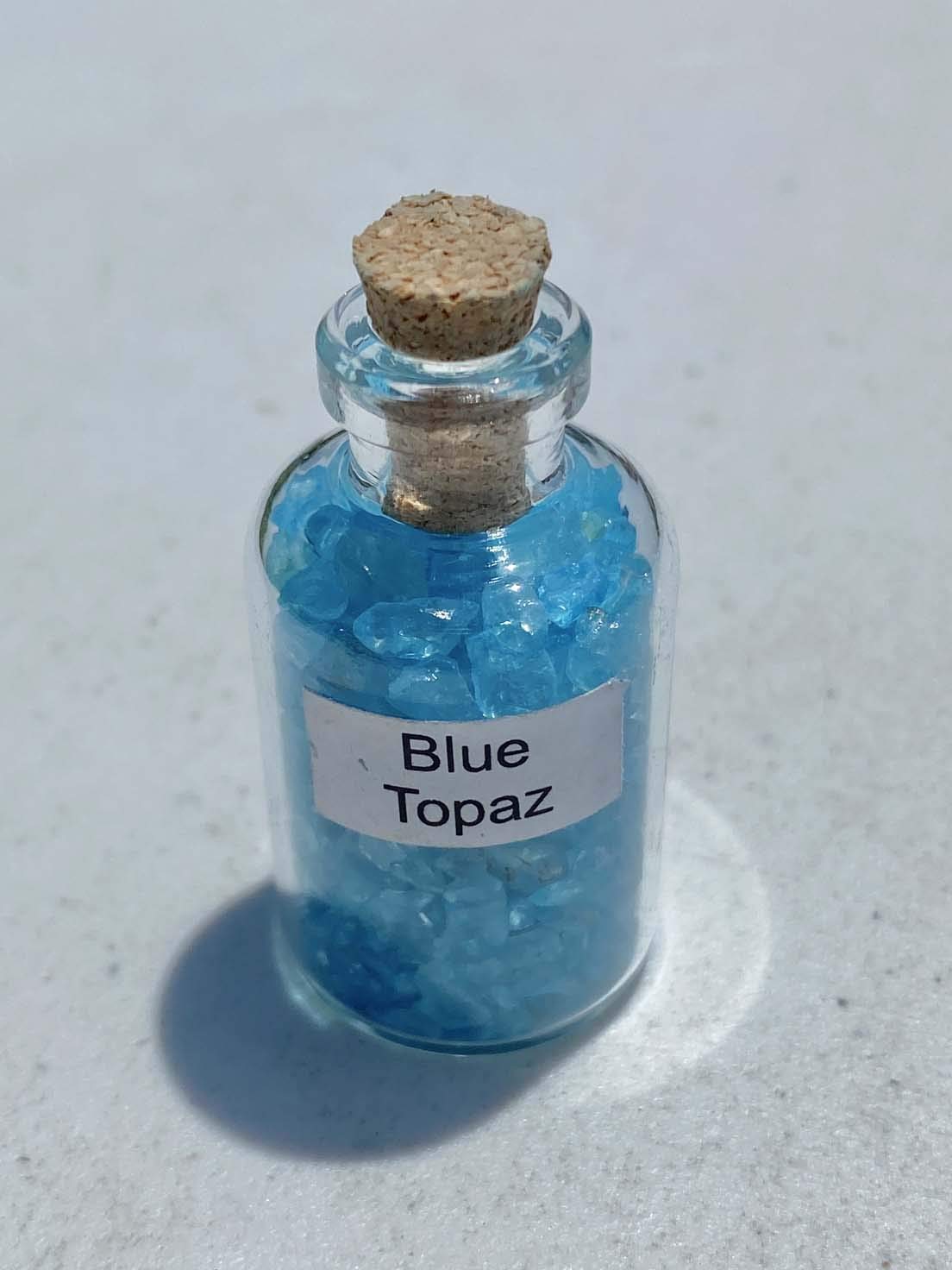Generic Blue Topaz Crystal Mini Bottle with cork stopper for portable display.