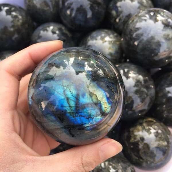 Labradorite ball catching natural light to reveal vibrant iridescence.