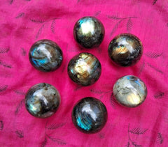 Generic Labradorite sphere on metal stand for elegant display.
