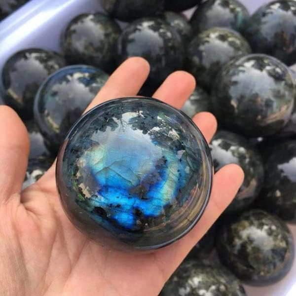 Labradorite tabletop decor ball enhances living space with shimmer.