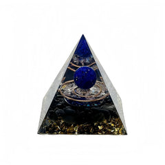 Generic orgone pyramid with amethyst and obsidian on a desk for positive energy.