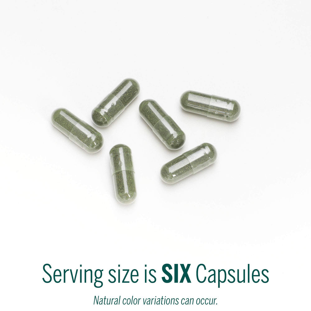 Genestra Phyto Greens Capsules pouring shot suggests easy daily use in a routine.