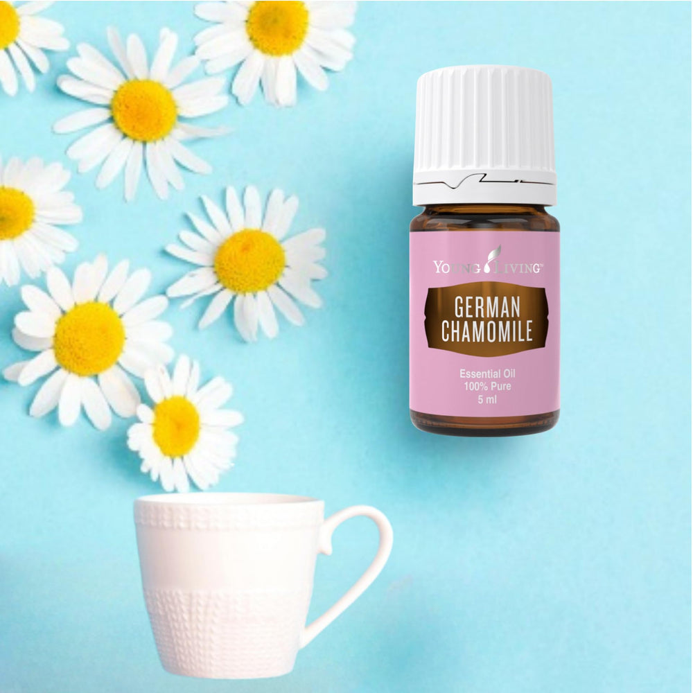 German Chamomile essential oil label on a dark glass bottle.