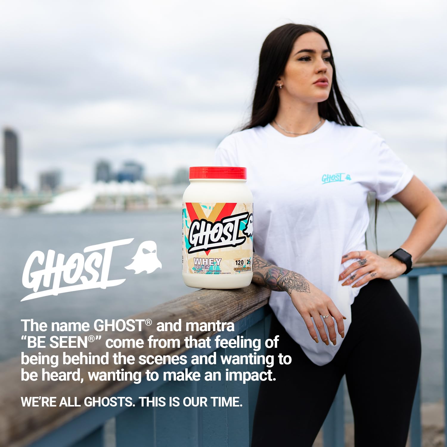 Ghost protein powder being mixed with milk in a shaker bottle.