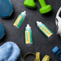 GHT Oxygen Elements Max bottle beside athletic gear during a workout