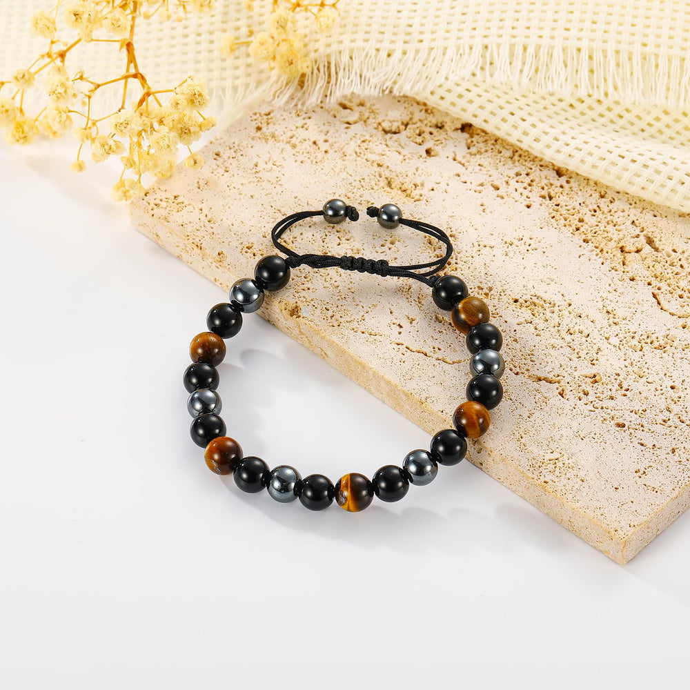 Gnamy bracelet featuring black obsidian bead helps absorb negativity and foster courage.