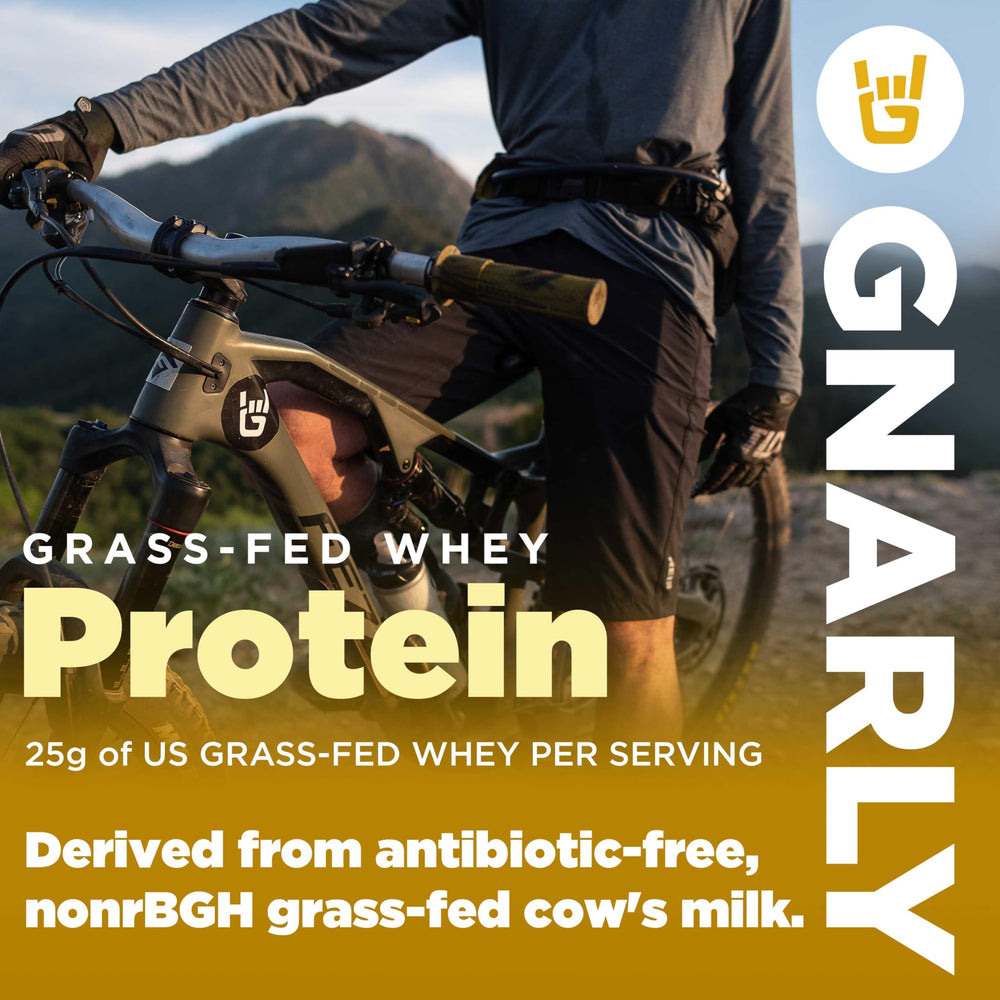 Creamy chocolate protein shake poured into a glass beside Gnarly tub