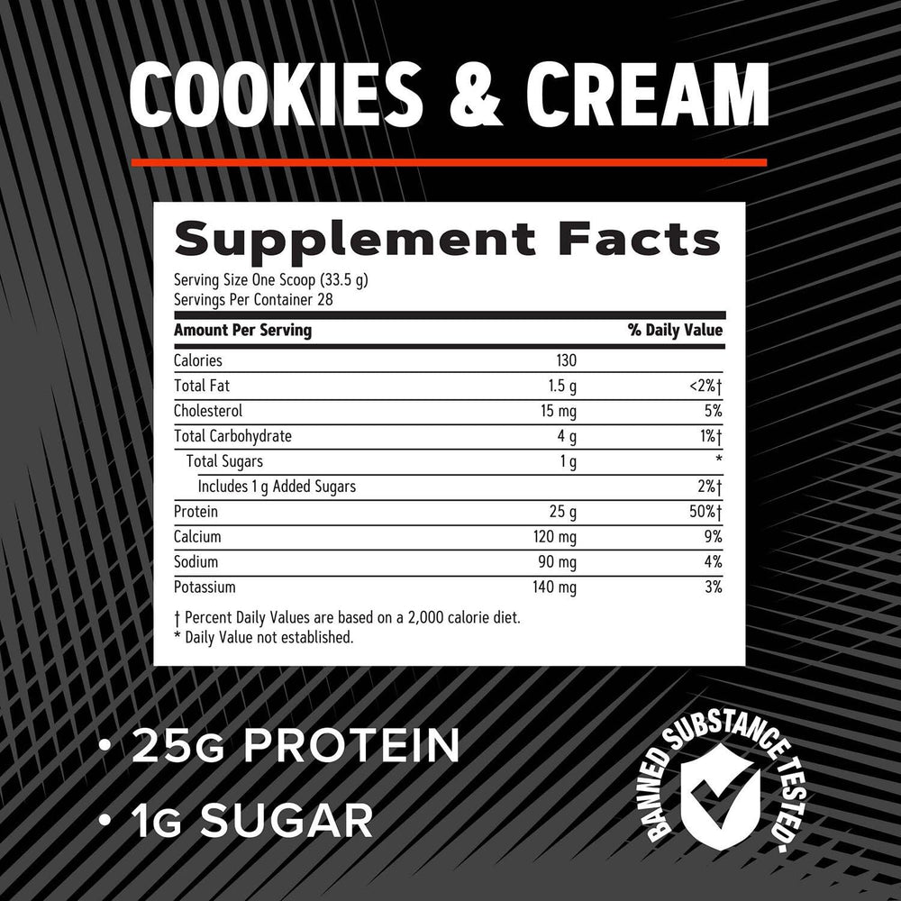 GNC AMP Pure Isolate Cookies & Cream tub on kitchen counter ready to mix