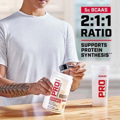 GNC Pro Performance Essential Amino Complete pour action demonstrating fast-digesting amino acids.