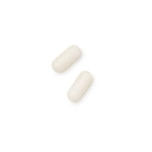 GNC Selenium tablets on white surface illustrate simple, everyday supplementation