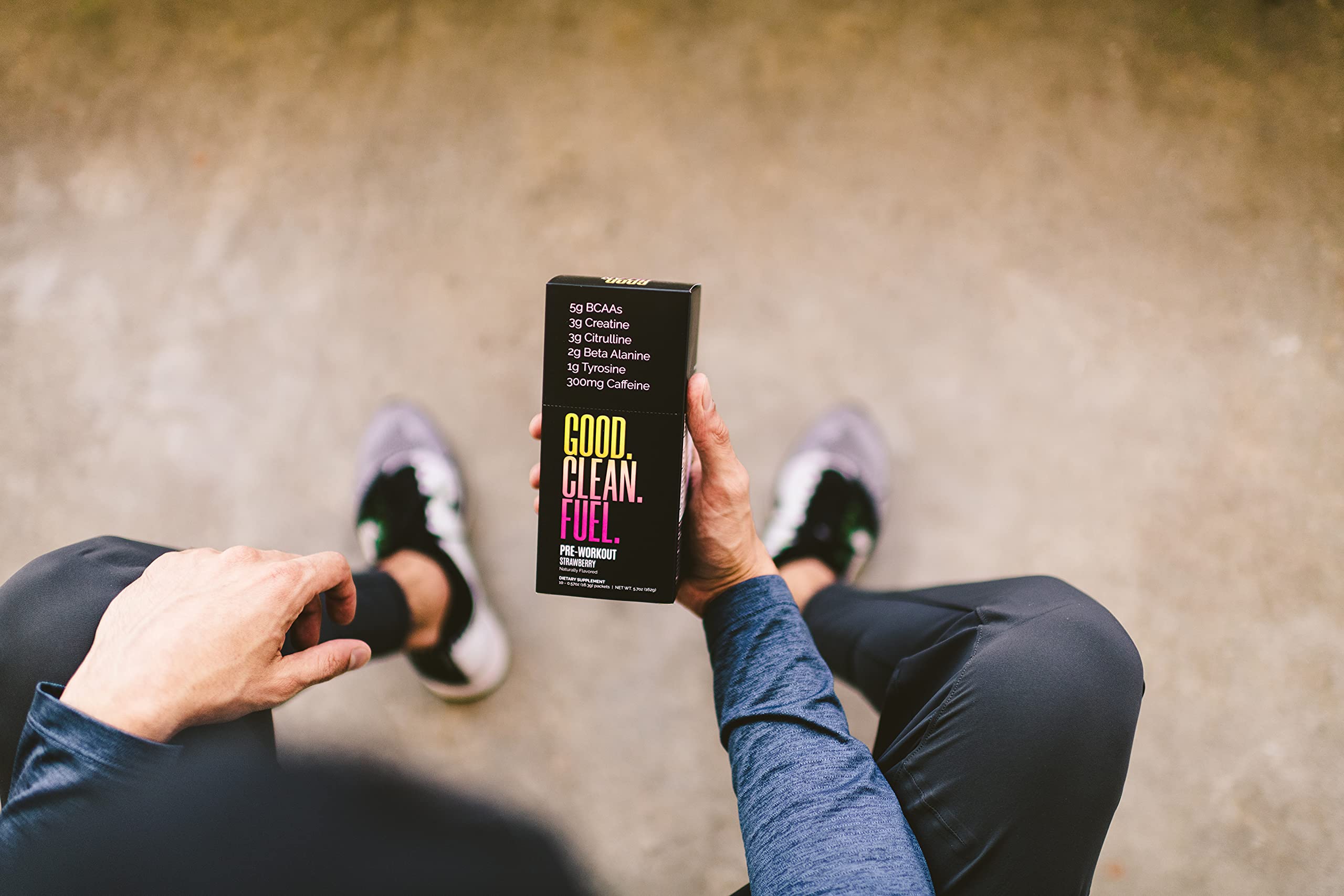 Single-serve Good Clean Fuel packet beside scoop for quick pre-workout prep