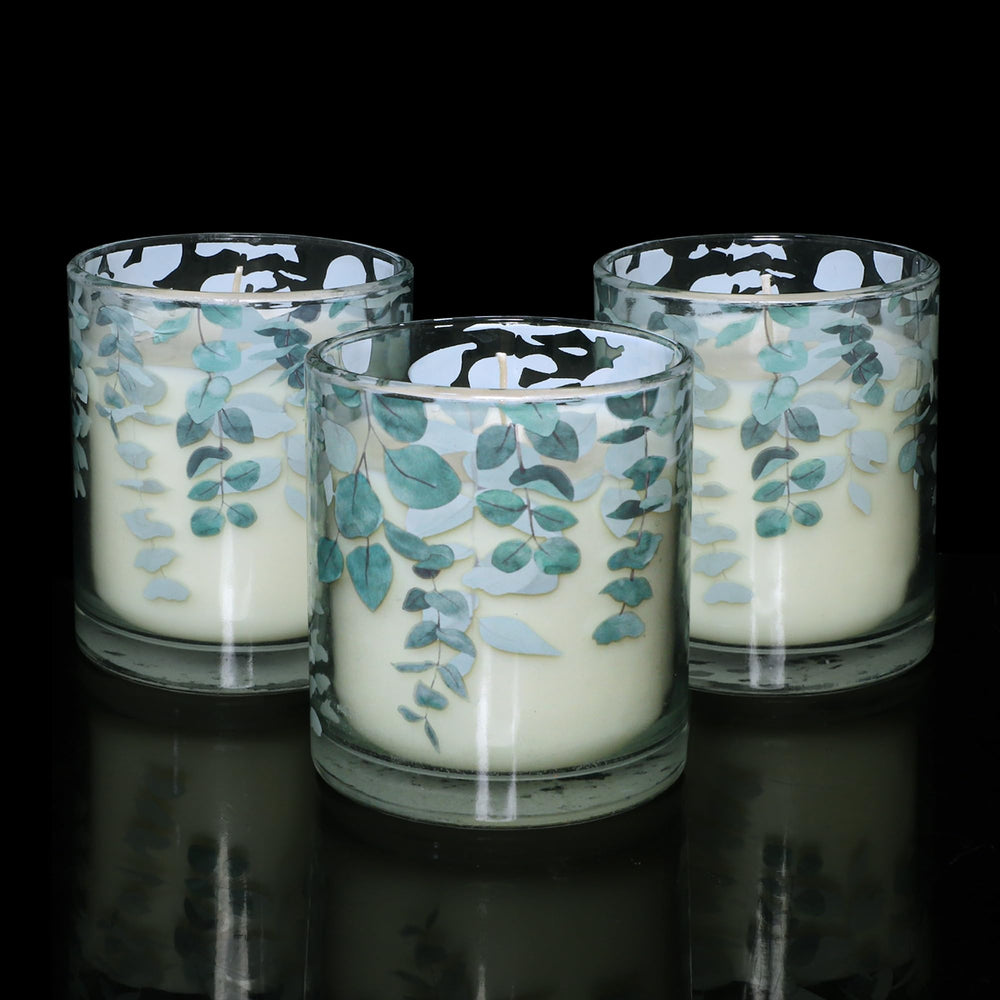Gorge Moment green decorative glass candle enhances shelves with modern botanical charm.