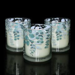 Gorge Moment green decorative glass candle enhances shelves with modern botanical charm.