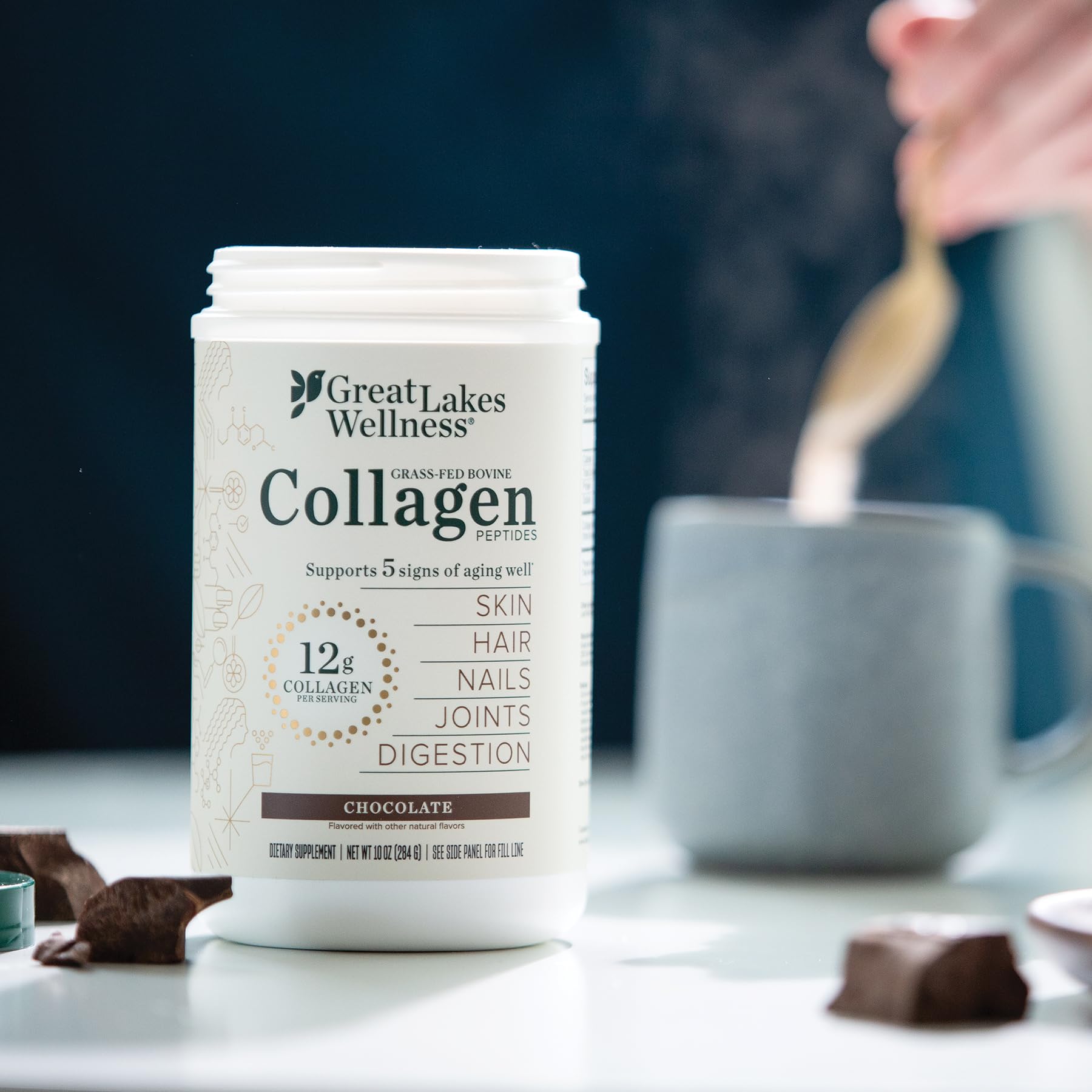 Great Lakes Wellness collagen peptides chocolate added to tea for a gentle boost.