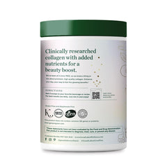 Great Lakes Wellness Raspberry Lemonade flavor powder in glass with spoon for mixing.