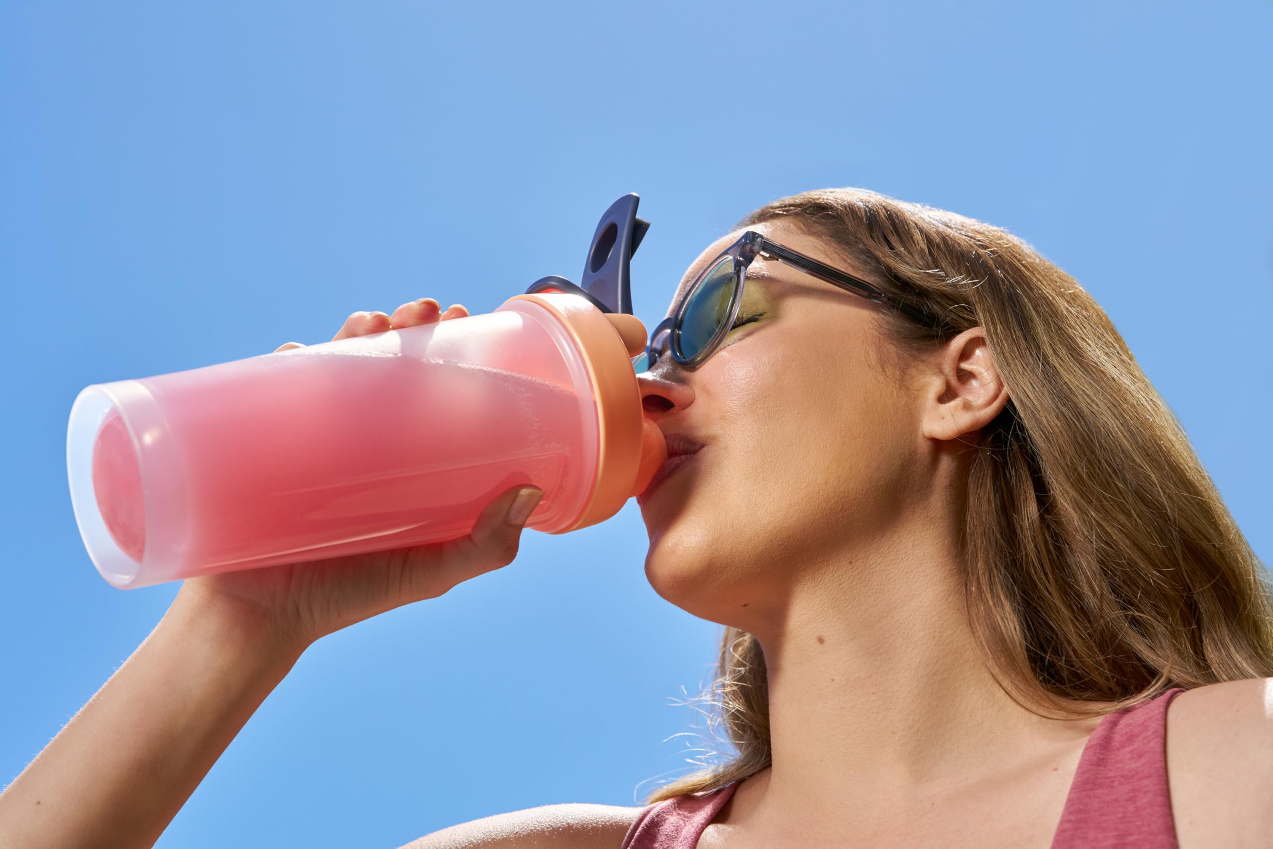 Great Naturally Hydration+ Watermelon powder mixing in a glass of water.