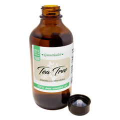 GreenHealth Tea Tree Oil label close-up showing 100% pure essential oil
