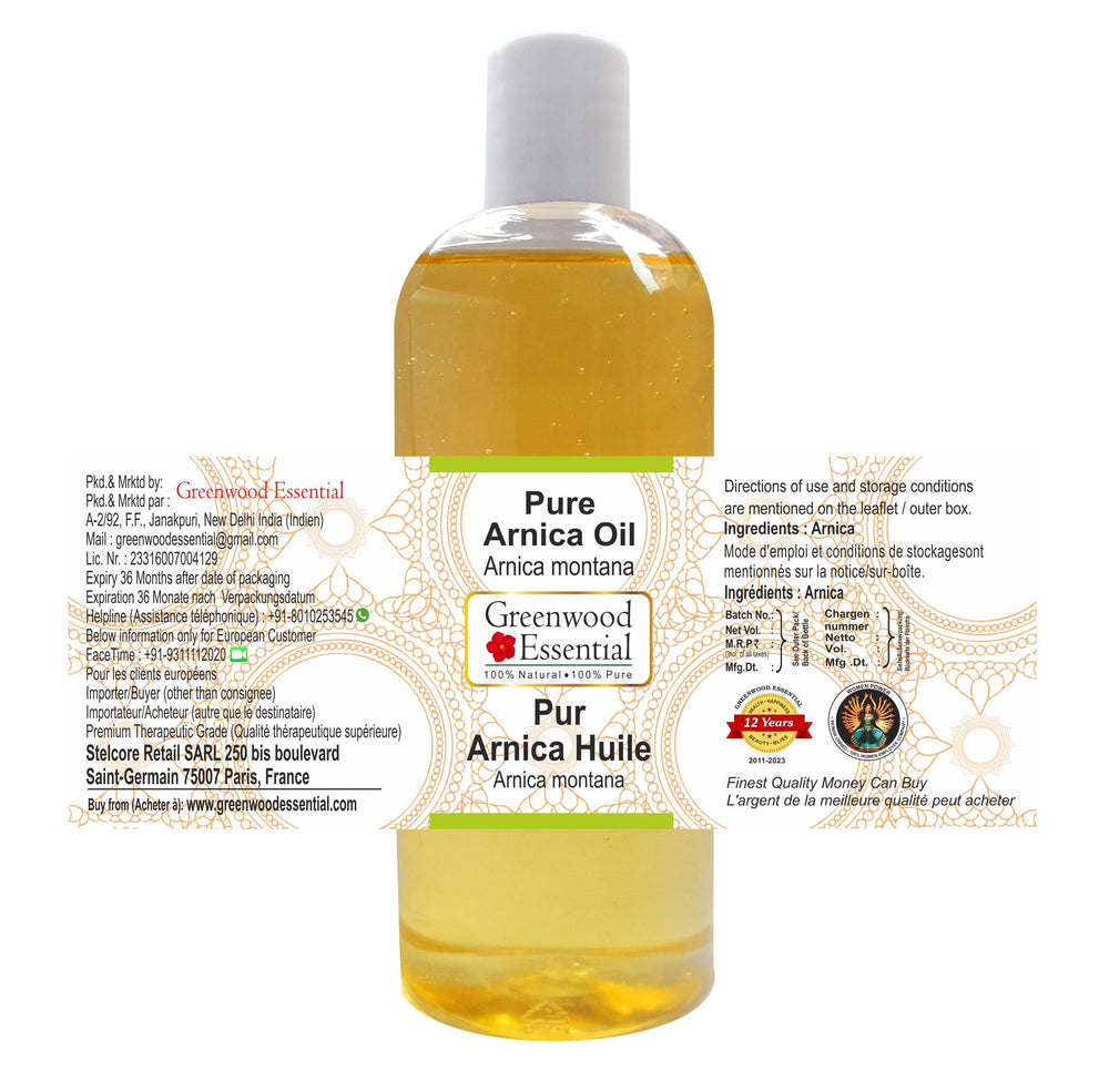 Close-up of Greenwood Essential Arnica Oil label showing purity.