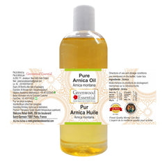 Close-up of Greenwood Essential Arnica Oil label showing purity.