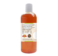Greenwood Essential Babchi Oil bottle with dropper showing application for skincare.
