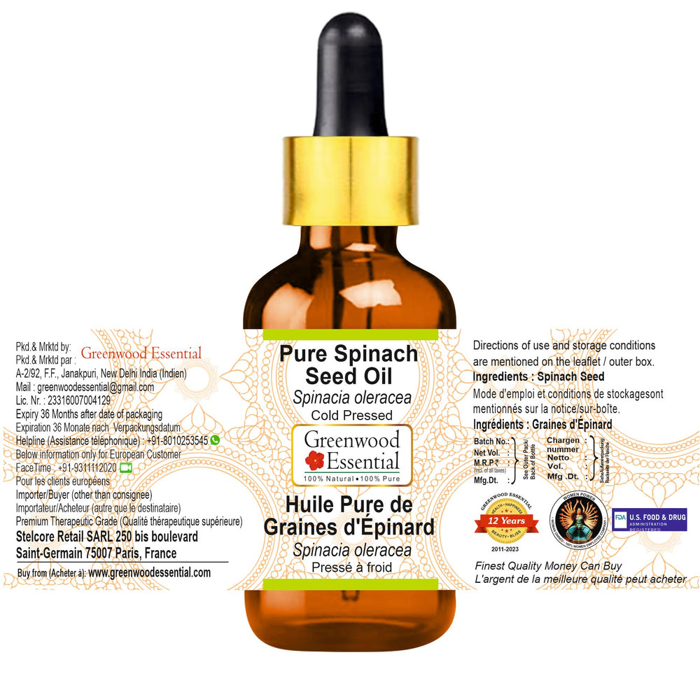 Close-up of Greenwood Essential Spinach Seed Oil dropper releasing oil for skin nourishment.