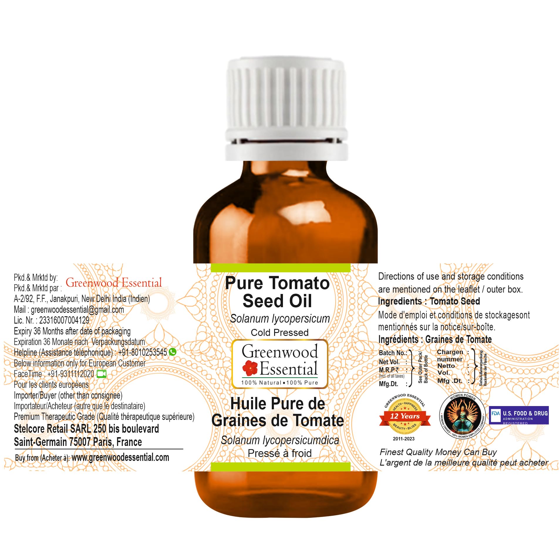 Close-up of Greenwood Essential label on Tomato Seed Oil showcasing purity.