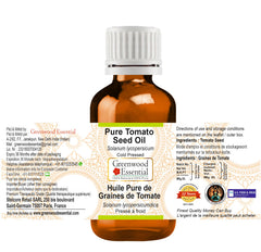 Close-up of Greenwood Essential label on Tomato Seed Oil showcasing purity.