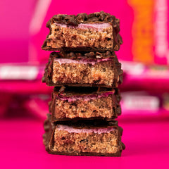Grenade Raspberry bar bite, creamy raspberry caramel and soft nougat.