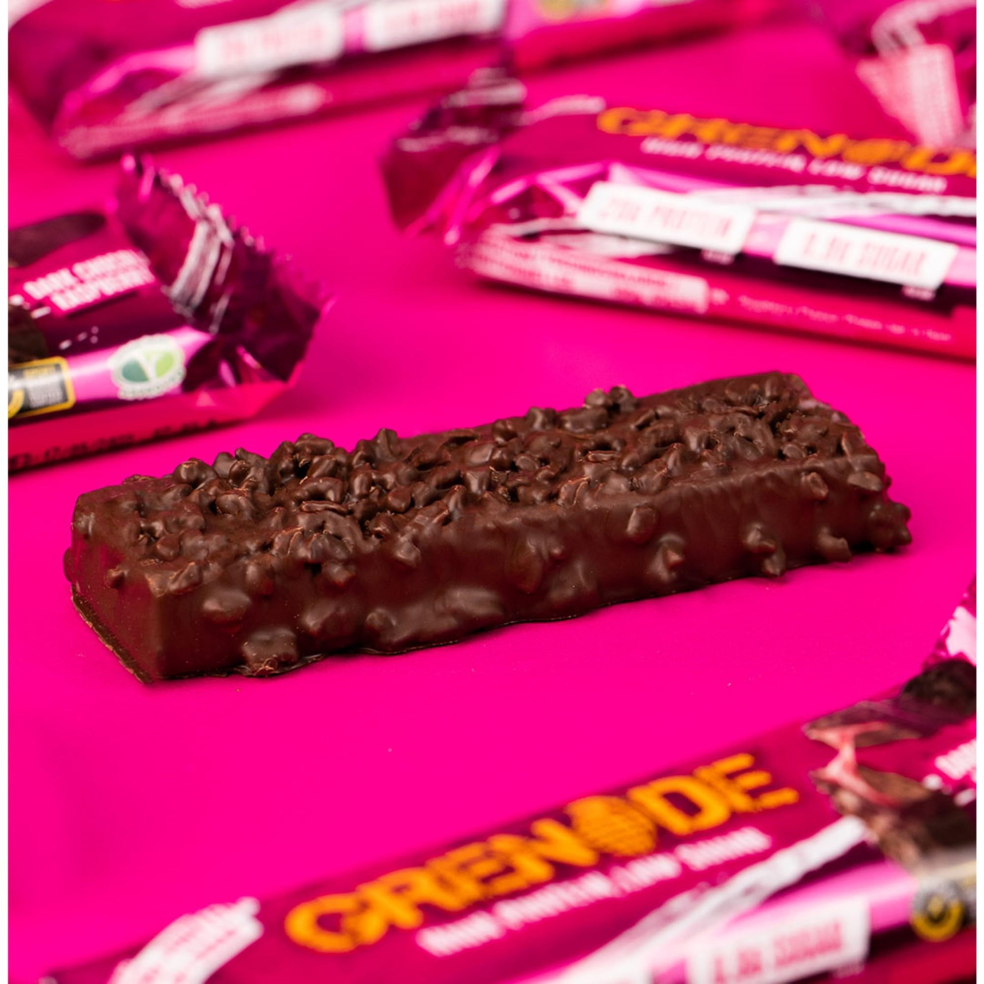 Grenade coating close-up, dark chocolate glaze and chunks.