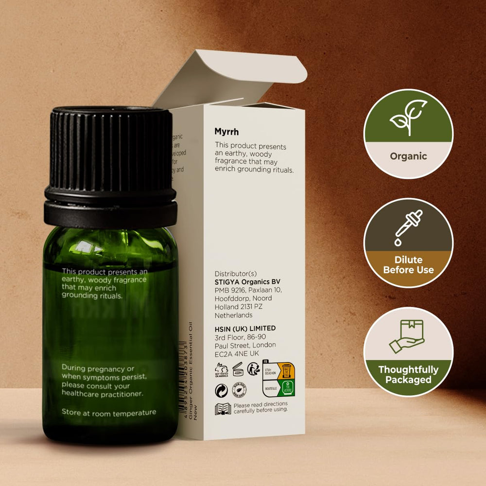 Gya Labs Organic Myrrh oil hair care shot demonstrates scalp massage preparation.