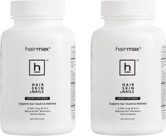 Hairmax biotin bottle label shows 2500 mcg for hair health and elasticity.