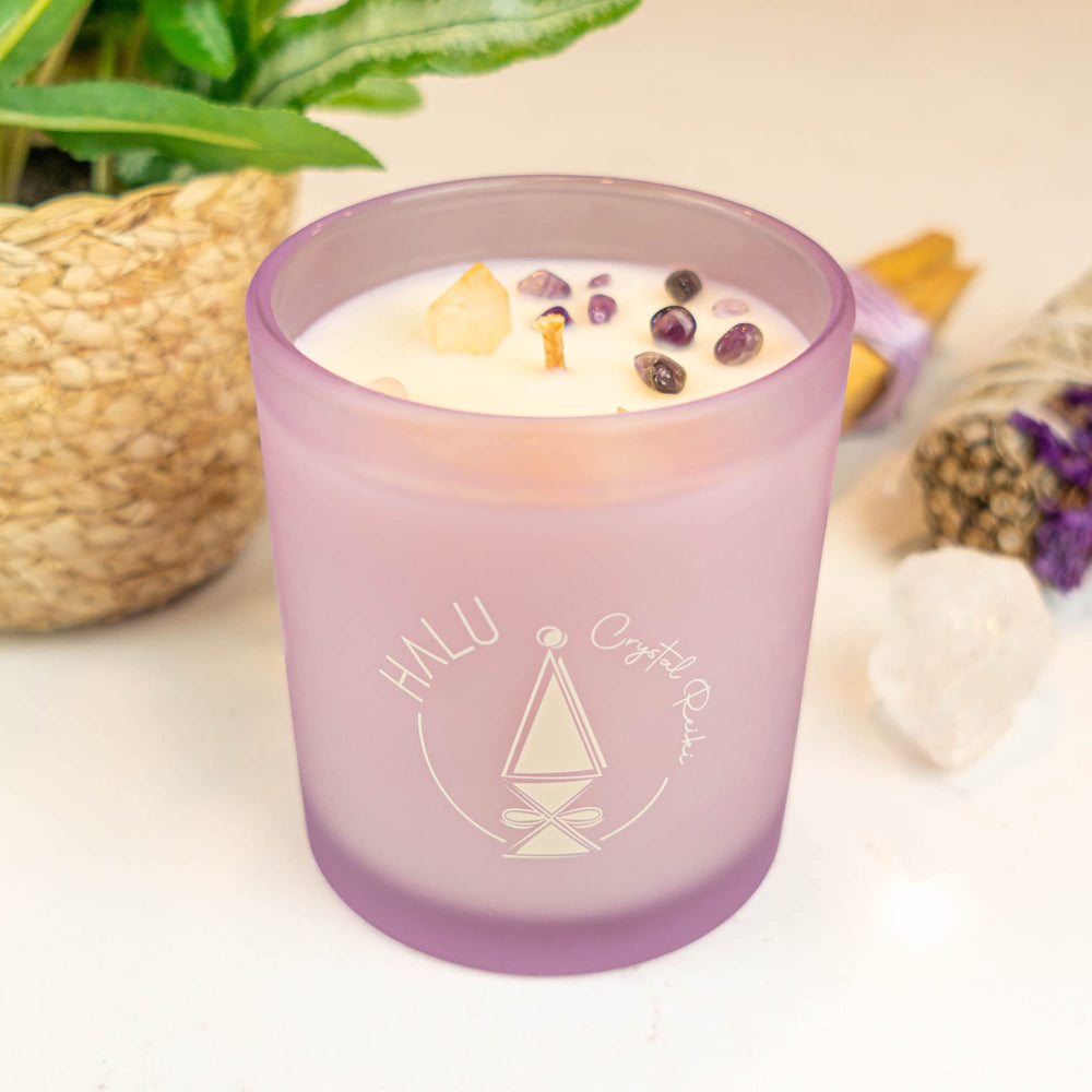 Halu Crystal Reiki lavender-vanilla candle burning fills the room with serenity
