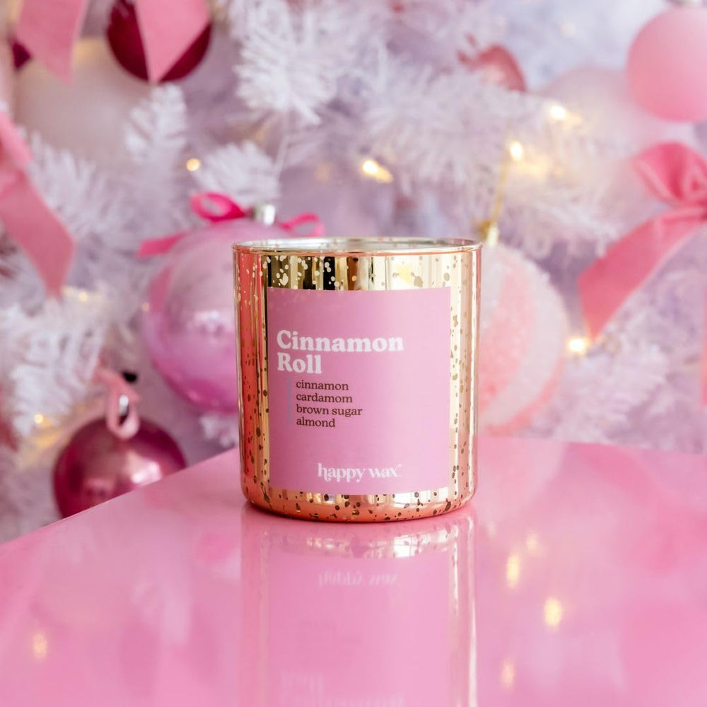 Happy Wax Cinnamon Roll candle releasing warm fragrance throughout room