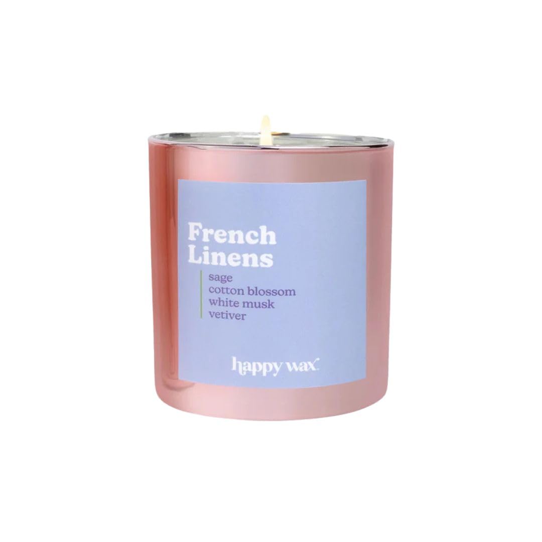 Happy Wax French Linens candle jar releasing a cozy, laundry-scented atmosphere.