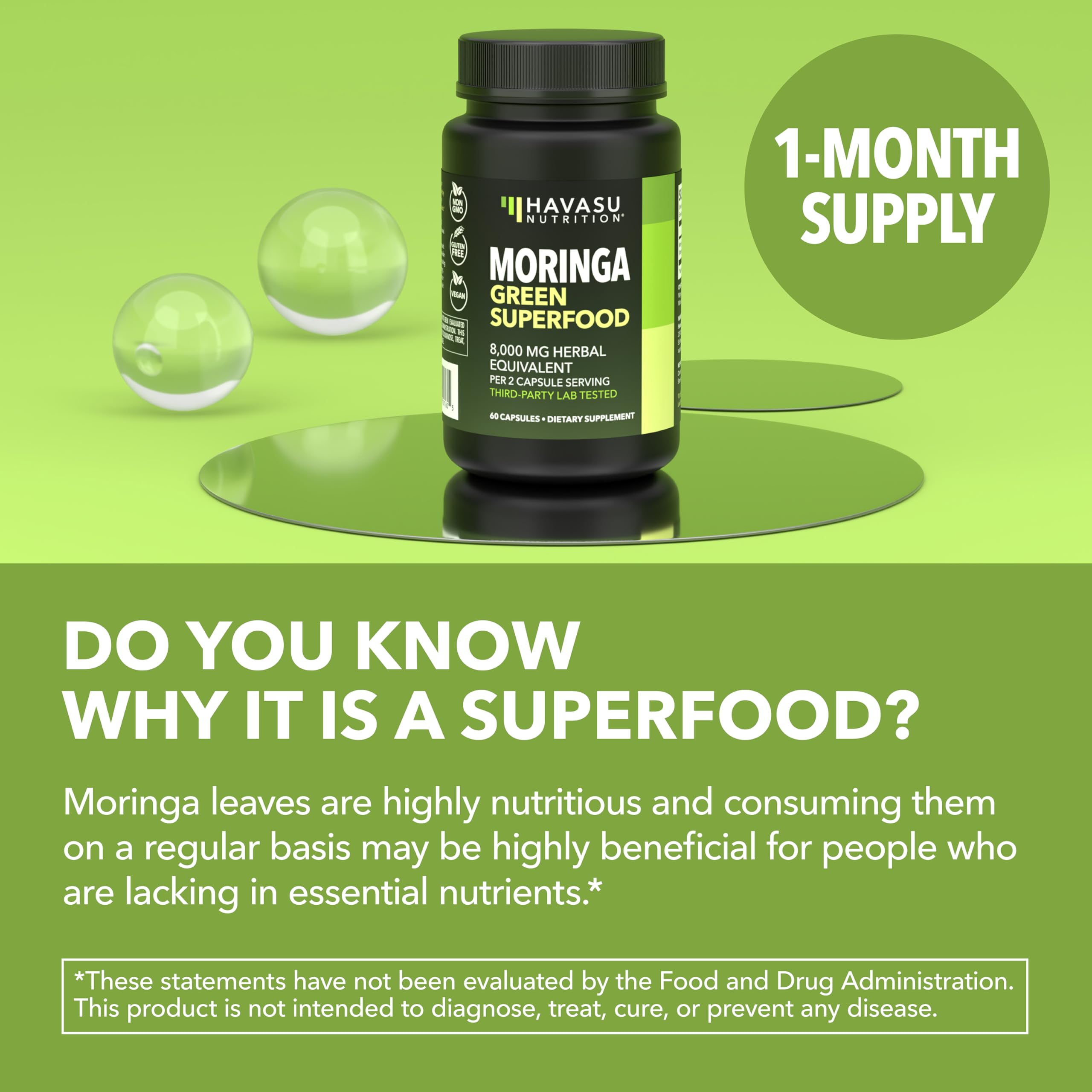 Green superfood capsules sit beside a glass of water.