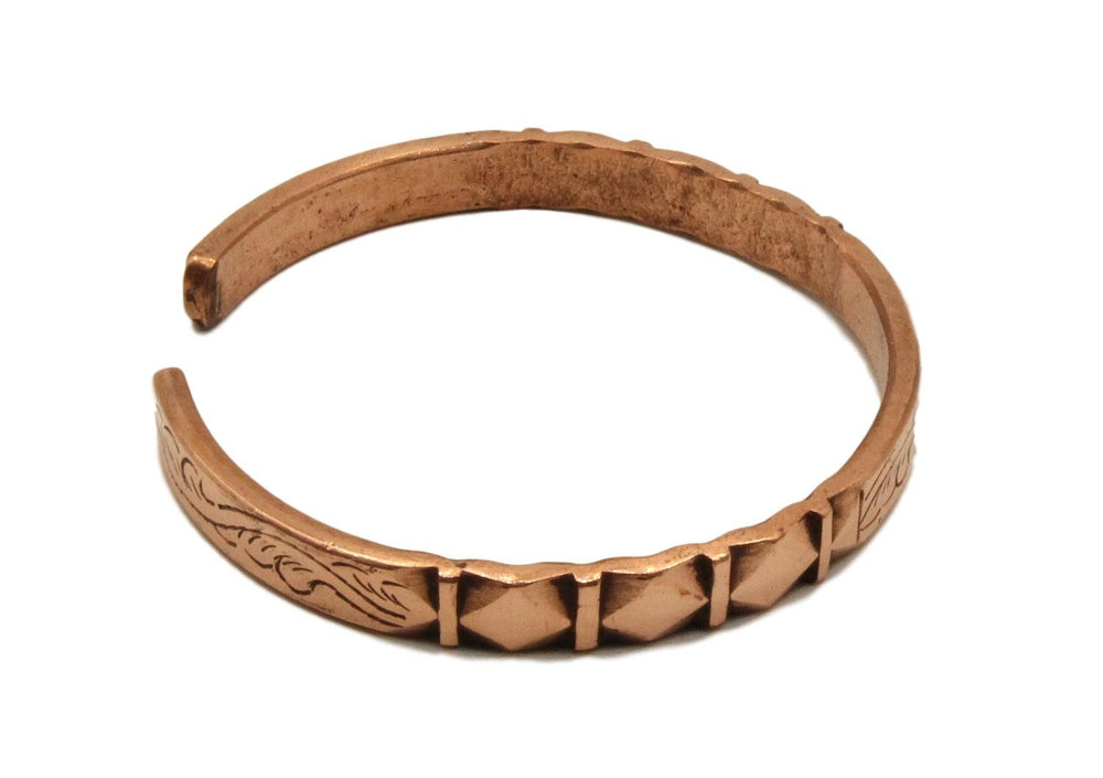 Healing Lama copper bracelet carved detail shows intricate work and lasting finish.