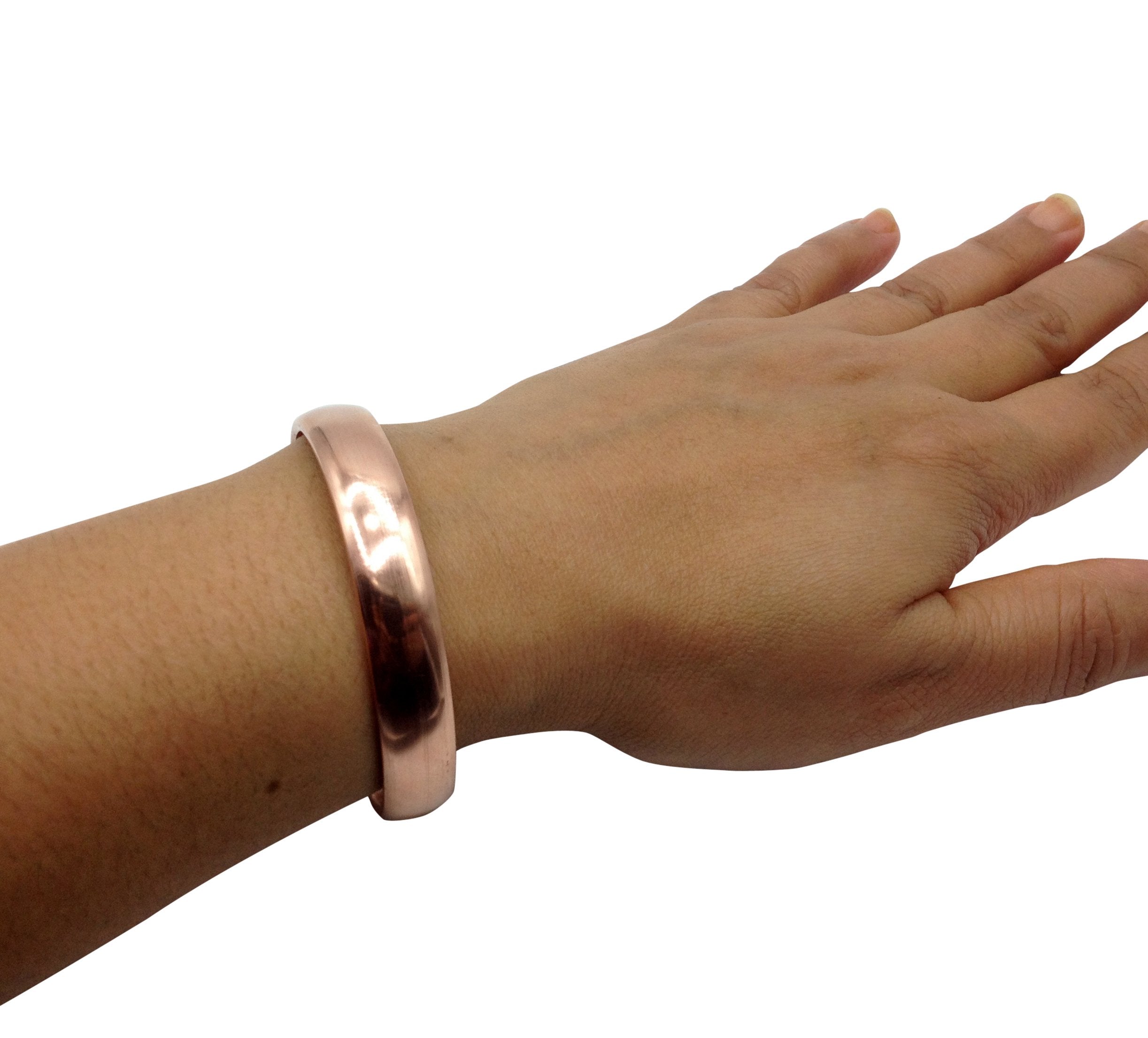 Healing Lama copper bracelet on a wooden surface for versatile styling ideas.