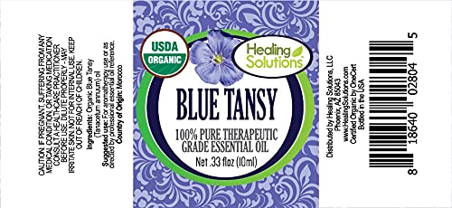 Healing Solutions Blue Tansy oil label highlights organic purity.
