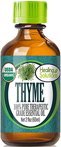 Healing Solutions Thyme Oil bottle close-up showing purity and organic quality.