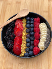 Health and Harmony smoothie bowl topped with bee pollen granules for color and nourishment.