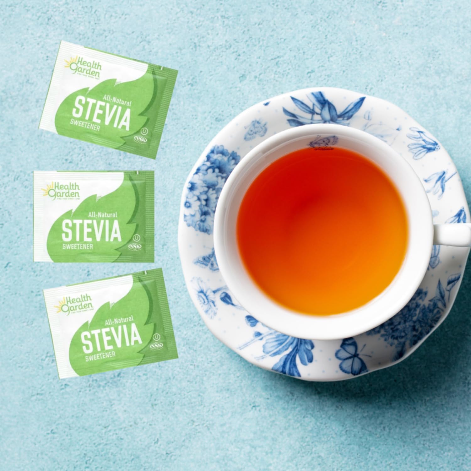 Health Garden Stevia packets beside a coffee cup emphasizing portion control