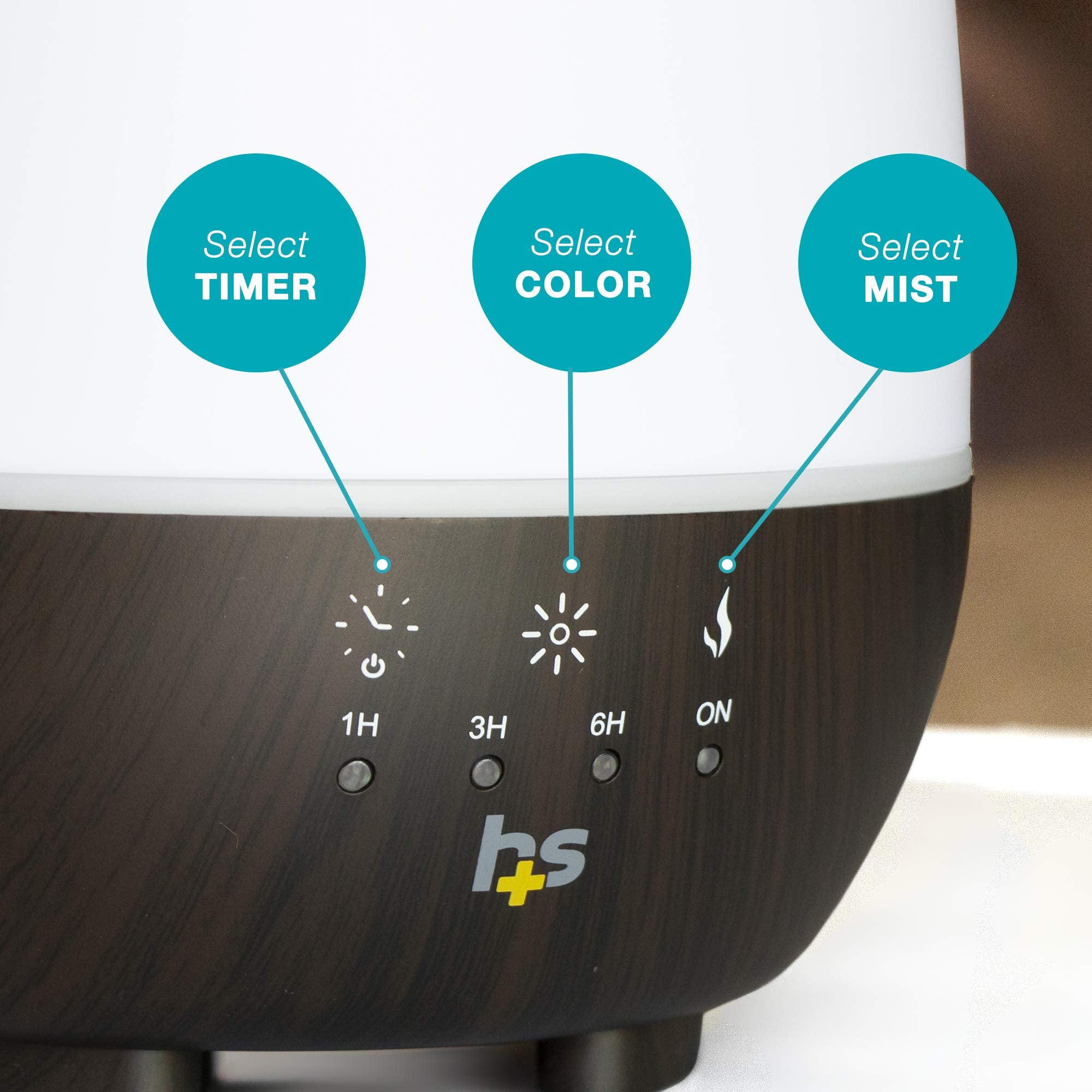 Diffuser on bedside table with soft color glow.