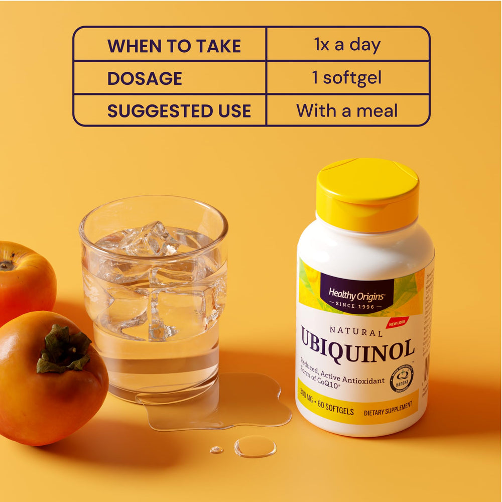 Healthy Origins ubiquinol softgels beside a glass of water