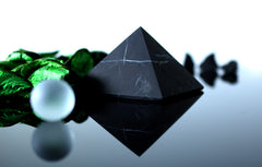 Heka Naturals meditation pyramid serves as a centerpiece for mindful practice at home.