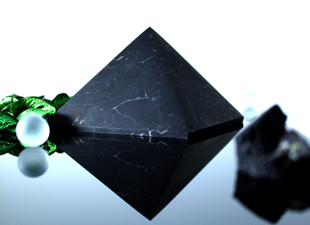 Heka Naturals Shungite pyramid centerpiece enhances desks or shelves with a subtle protective vibe