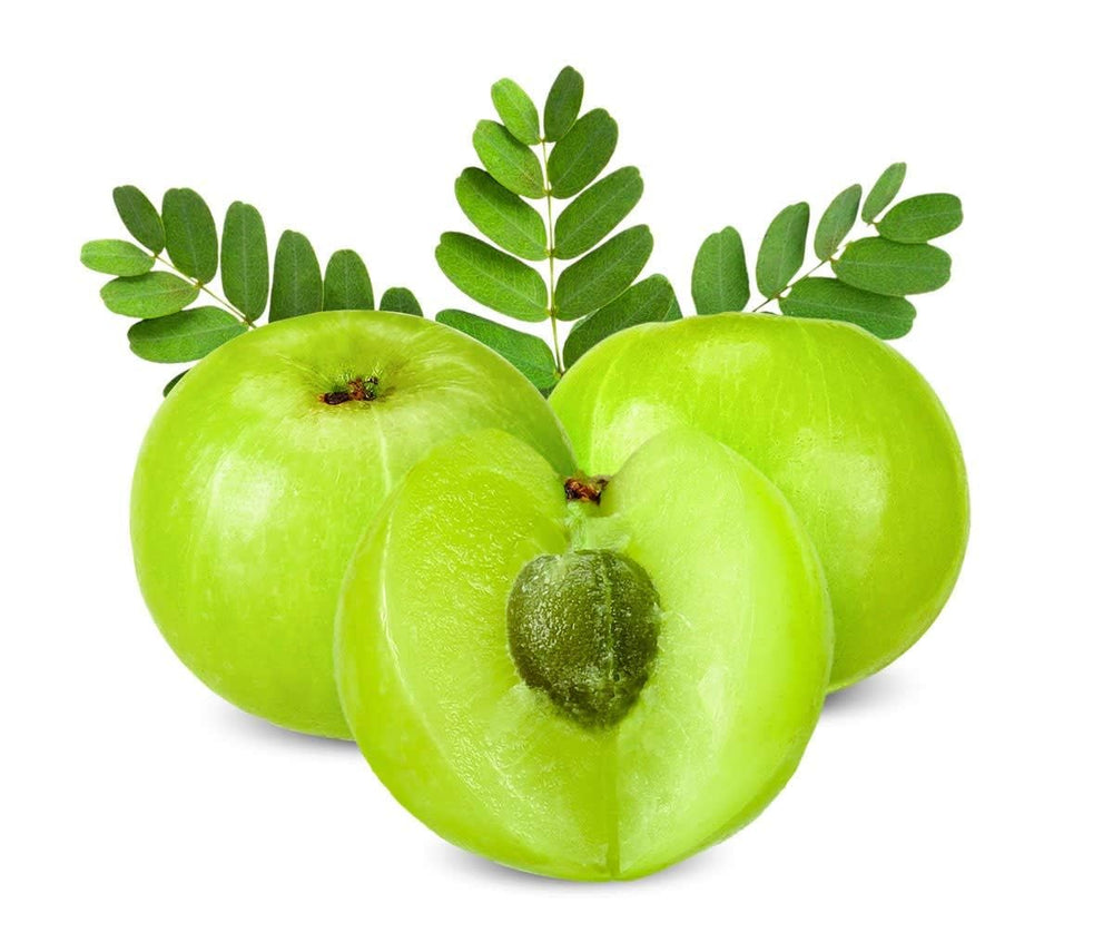Amla powder next to fresh fruit for a nutrient boost