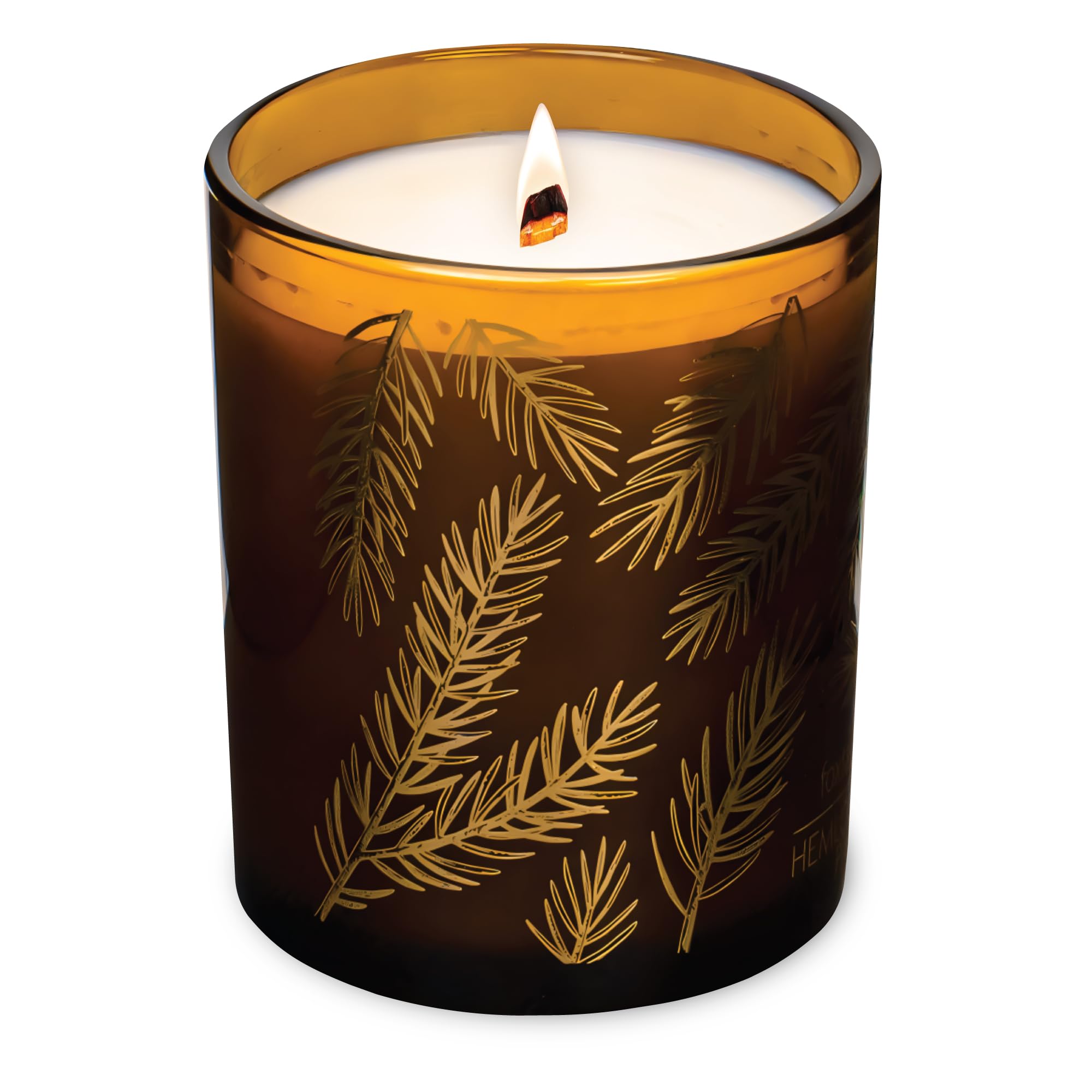 Hemlock Park Amber Gold Leaf glass candle emitting a subtle aroma in a cozy space