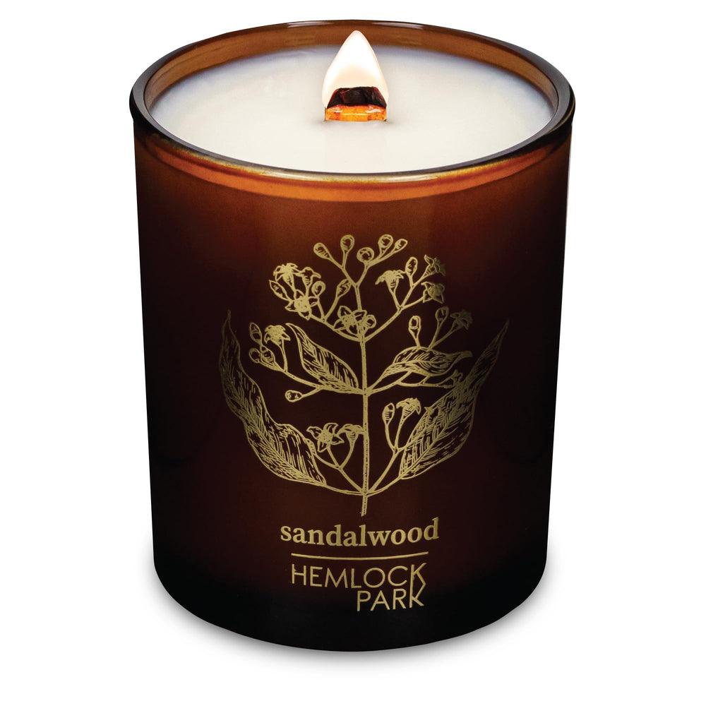 Hemlock Park Amber & Gold Wood Wick Candle jar with warm amber glow and subtle aroma.
